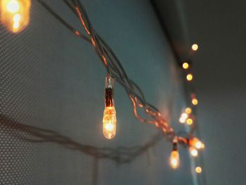 Illuminated lighting equipment hanging at night