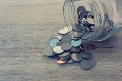 High angle view of coins on table