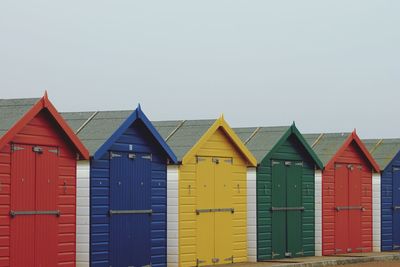 Beach huts against sky