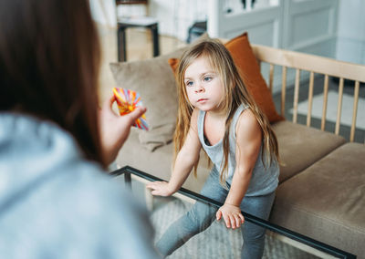 High angle view of woman and daughter playing