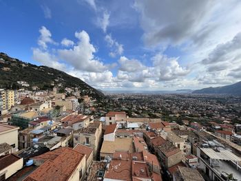 Cityscape over palermo, cloudy sky, sea on the background