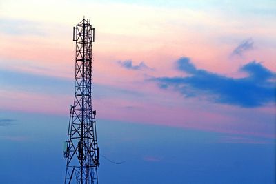 Low angle view of electric pole against sky