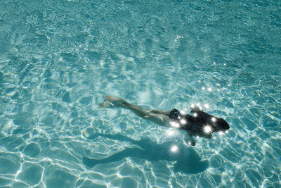 High angle view of girl swimming in pool