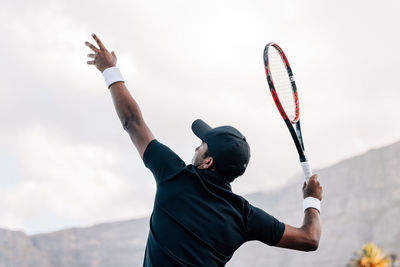 Cropped hand holding tennis