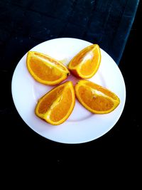 High angle view of orange fruits on table