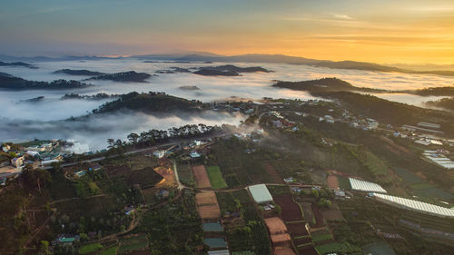 High angle view of townscape against sky during sunset