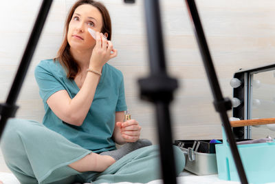 Portrait of a young woman looking away