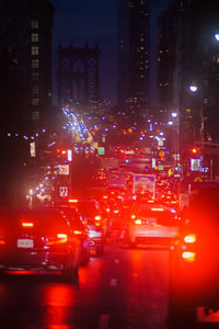 Illuminated city street at night