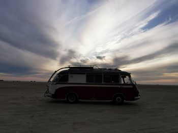 Vintage car on road during sunset