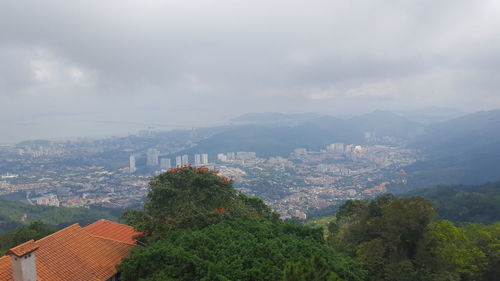 High angle view of buildings in city against sky