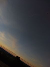 Scenic view of silhouette landscape against sky at sunset