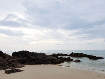 Scenic view of sea against cloudy sky