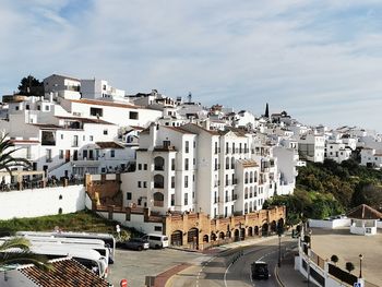 High angle view of buildings in city against sky