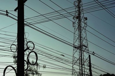 Low angle view of electricity pylon