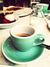 Close-up of coffee cup on table