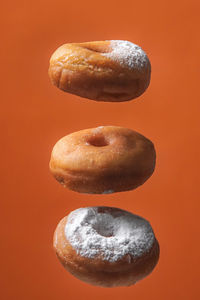 Close-up of cookies against yellow background