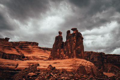 Rock formations against grey sky