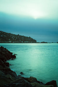 Scenic view of sea against blue sky