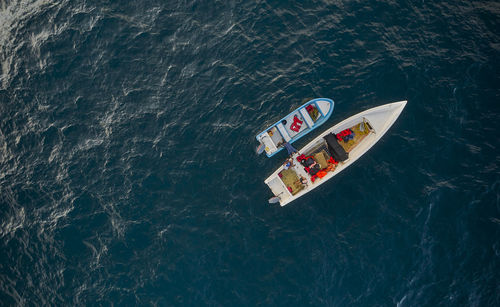 Aerial view of traditional fishing boat in caraballeda with crystal clear turquoise sea, la guaira