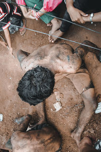 Directly above shot of man covered in mud