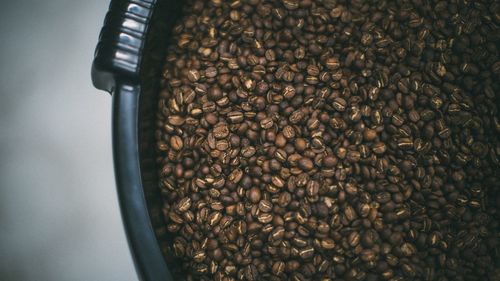 Close-up of roasted coffee beans in container