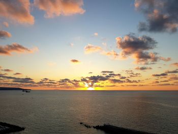 Scenic view of sea against sky at sunset