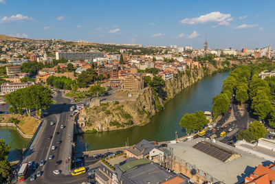 High angle view of river amidst buildings in city