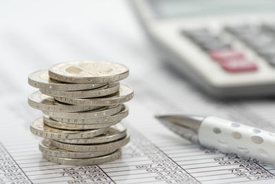 Close-up of coins on table