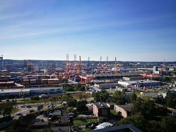 High angle view of buildings against clear blue sky