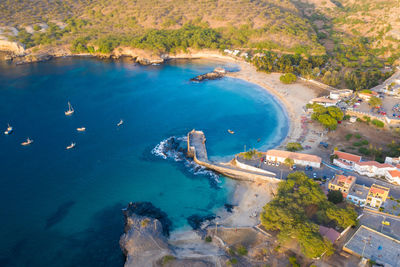 Aerial view of buildings by sea