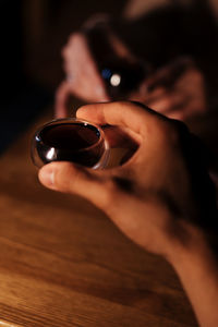 Cropped hand of woman using mobile phone