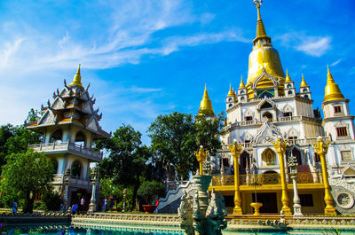 Low angle view of temples against blue sky