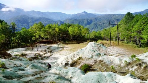 Scenic view of rocks in mountains against sky