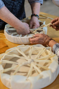 Close-up of people preparing food