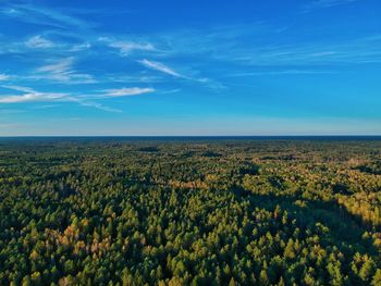 Scenic view of landscape against blue sky