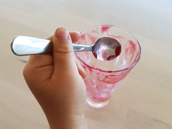 Close-up of hand holding glass