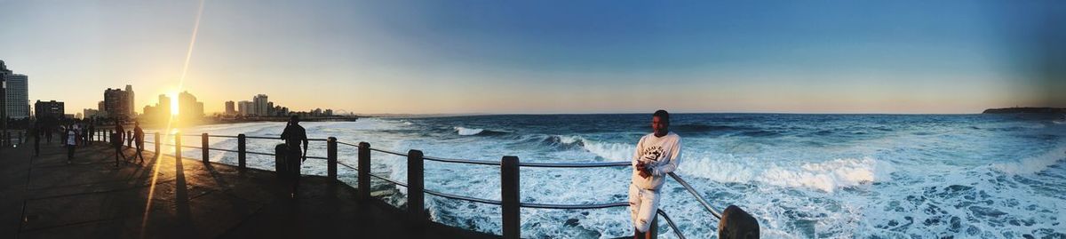 Panoramic view of sea against sky during sunset