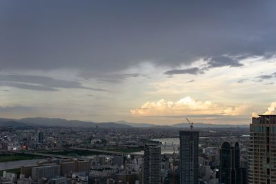 Aerial view of city buildings during sunset