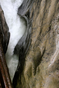 Close-up of water flowing through rocks