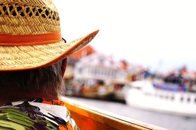 Rear view of man wearing straw hat