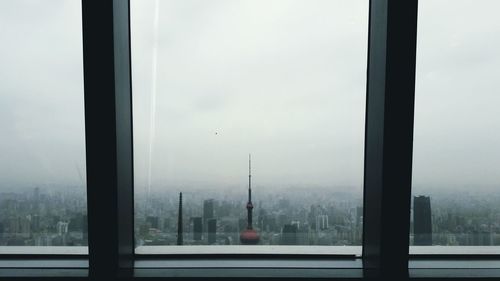 Cityscape seen through window