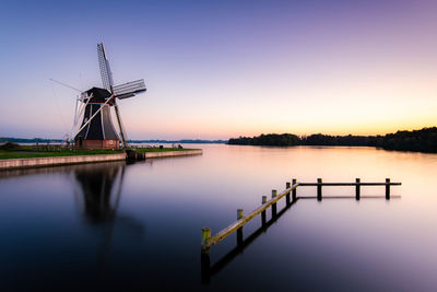Windmill at blue hour from paterswoldsemeer near groningen city, netherlands.