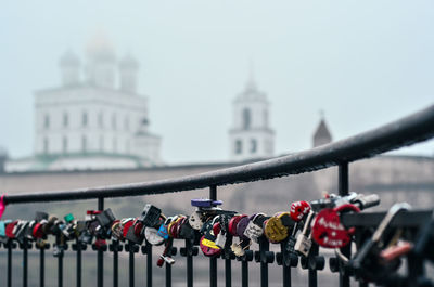 Close-up of padlocks on railing