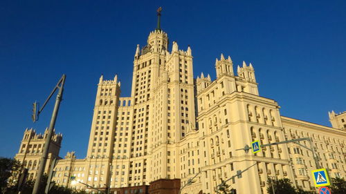 Low angle view of buildings against blue sky