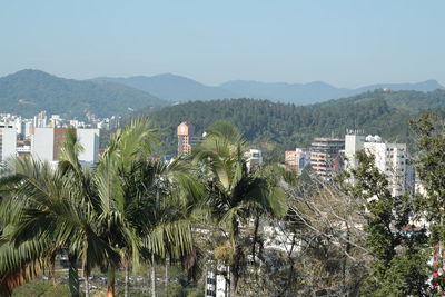 Panoramic view of trees and mountains against clear sky