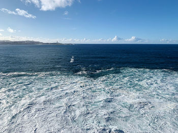 Scenic view of sea against blue sky at atlantic coast. winter