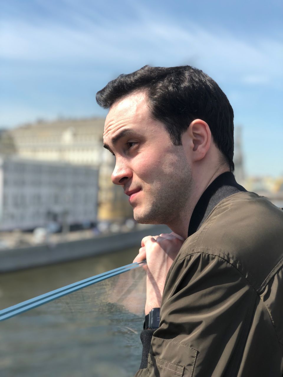 one person, real people, lifestyles, architecture, leisure activity, headshot, built structure, focus on foreground, young adult, young men, looking, side view, portrait, nature, sky, water, looking away, building exterior, outdoors, contemplation