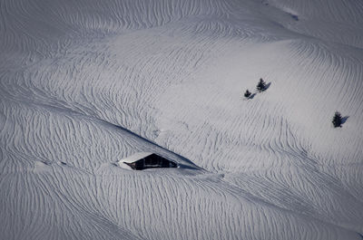 High angle view of snow and chalet