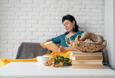 Woman sitting on table