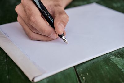 Close-up of man working on table